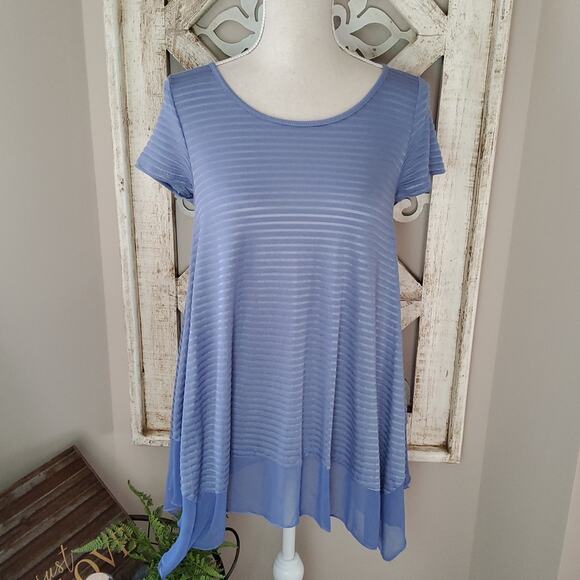 Alya from Francesca's Women's Short Sleeve Ruffle Asymmetric Hem Tunic Top Blue - Picture 2 of 9